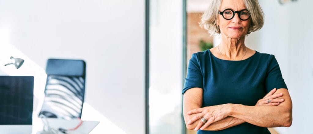 Confident mature businesswoman in office